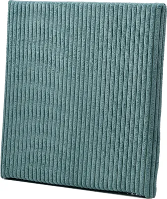 A close-up, studio shot of a teal corduroy cushion.