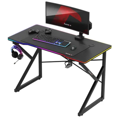 Produktbild von huzaro Hero 1.7 | Gaming Schreibtisch LED Beleuchtung | 120x60cm | Kopfhörerhaken Getränkehalter | Kohlefaseroberfläche | Kabeldurchführung | Schwarz