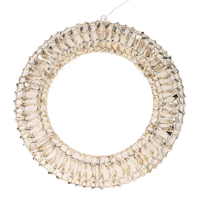 A circular wreath made of clear, faceted crystals and silver wire, suspended by a thin wire.