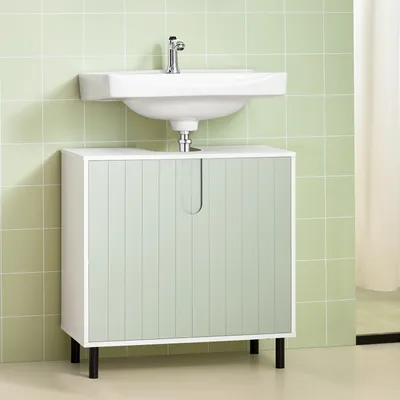 A bathroom vanity cabinet with a sink and faucet against a tiled wall.
