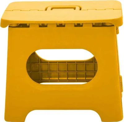 A yellow folding stool against a white background.