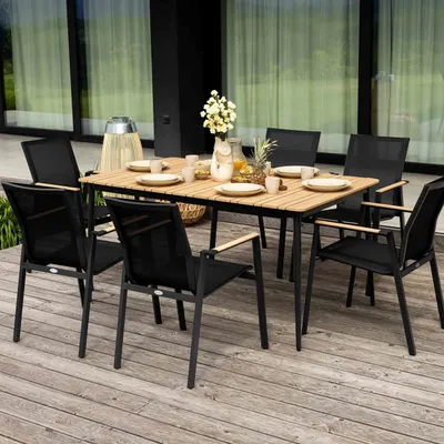 An outdoor dining set on a wooden deck.