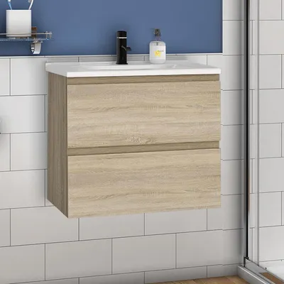 A bathroom vanity with a sink and faucet against a blue wall and white tiled background.