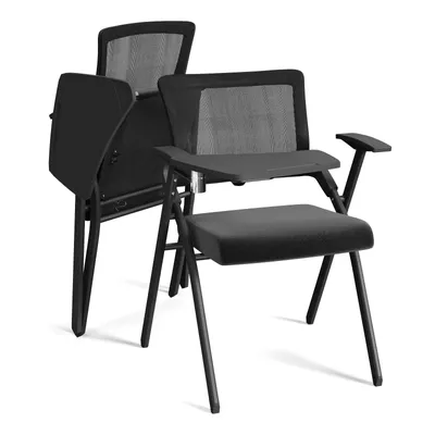 Two black folding chairs with writing tablets are displayed against a white background.