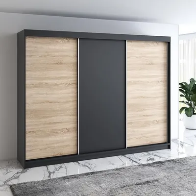 A modern sliding door wardrobe with a wood and dark gray finish, set against a light gray wall and marble floor.