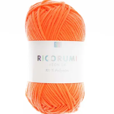 A ball of neon orange yarn with a white label.