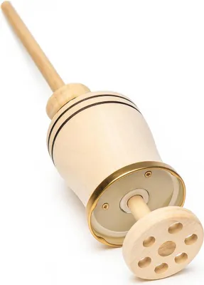 A wooden butter churn on a white background.