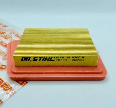A close-up, studio shot of a yellow air filter with an orange rubber gasket, placed on a white background.