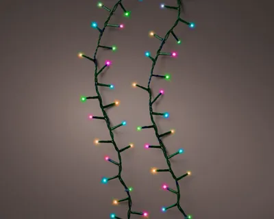 Two strands of colorful LED Christmas lights against a plain background.