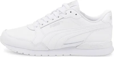 A white Puma sneaker shown from the side.