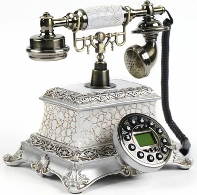 A vintage-style corded telephone with a decorative base and handset, set against a white background.