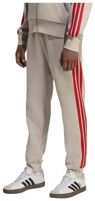 Zdjęcie produktu dla Spodnie Adidas Pantalón largo adidas Essentials Fleece 3 Stripes beige dla Męskie