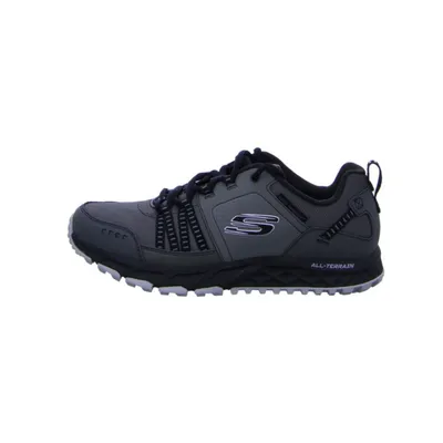 A side view of a gray and black Skechers walking shoe against a white background.