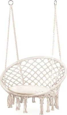 A white macrame hammock chair with a cushion, suspended by ropes.