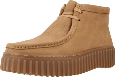 A single brown clog shoe is shown against a white background.