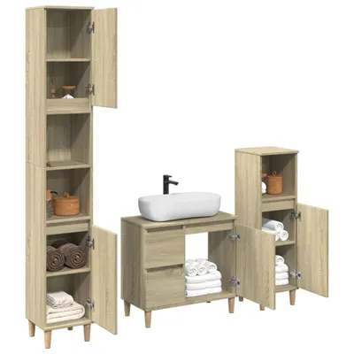 A set of three bathroom cabinets and a sink.