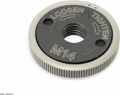 A close-up studio shot of a metal nut with engraved text and markings.