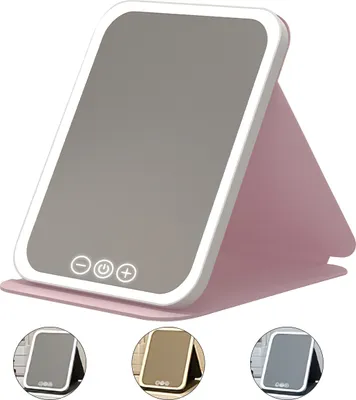 A pink makeup mirror with integrated LED lighting and touch controls, shown in a studio setting with other color variations displayed below.