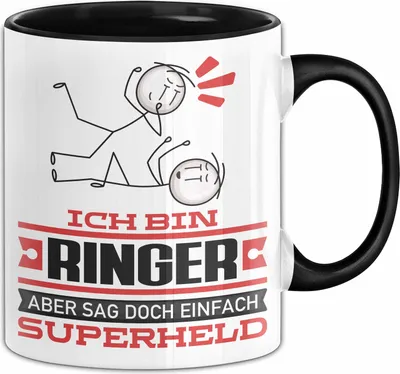 Produktbild von Ringer Geschenk Tasse Ich Bin Ringer Aber Sag Doch Einfach Superheld Lustige Geschenkdiee für Ringer Kaffee-Becher (Schwarz)