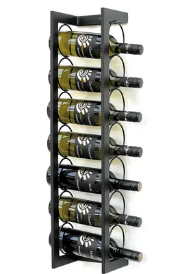 A black metal wine rack mounted on a white wall, holding seven bottles of wine.