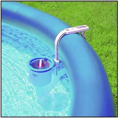 A skimmer basket attached to the side of an inflatable pool, with grass in the background.