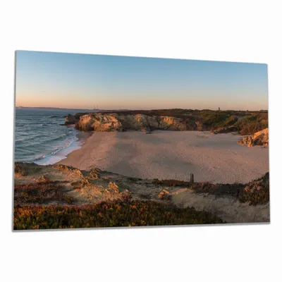 Produktbild von Wallario Herdabdeckplatte aus Glas, Größe 80 x 52 cm 1-teilig, Motiv Sandstrand zwischen Felsen