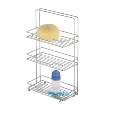 A chrome-plated three-tier shelf unit for bathroom or shower storage, with a sponge on the top shelf and a bottle and toothbrush on the bottom shelf.