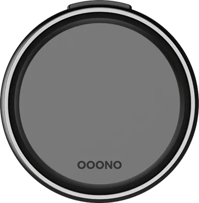A close-up, top-down view of a circular device with a gray screen and a black rim.