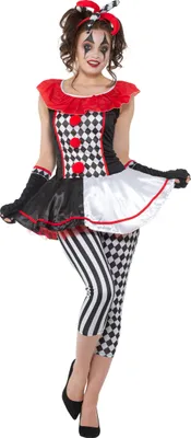 A woman wearing a harlequin costume.