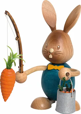 A wooden figurine of a rabbit holding a fishing rod with a carrot and a bucket of carrots.