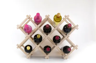 A wooden wine rack filled with various bottles of wine.