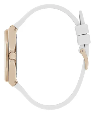 Side view of a women's watch with a white strap and rose gold case.