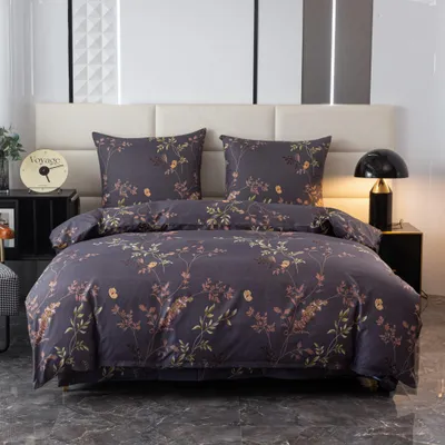 A neatly made bed with floral patterned bedding.