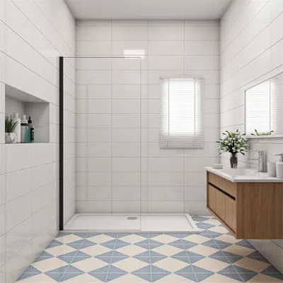 A modern bathroom with a walk-in shower, vanity, and tiled floor.