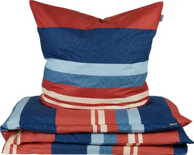 A stack of bedding with stripes.