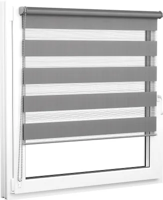 A close-up view of a grey and white striped roller blind installed on a white window frame.