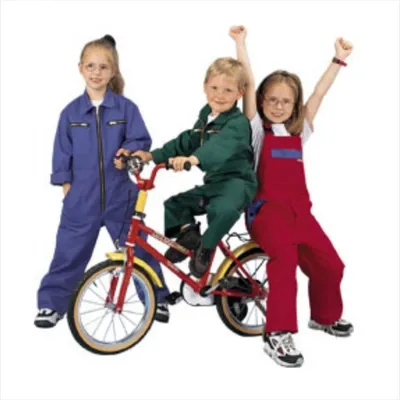 Three children posing with a bicycle.