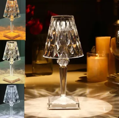A collage of images showcasing a crystal LED table lamp in different lighting conditions and colors, with some images featuring candles and a blurred background.