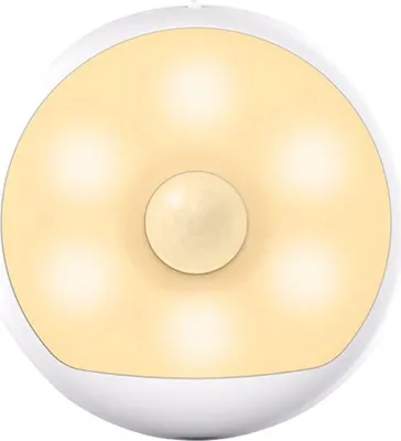 A white, circular night light with a central sensor and six illuminated sections.