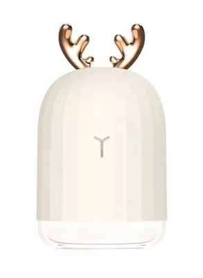 A white humidifier shaped like a deer with gold antlers.