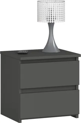 A gray nightstand with two drawers and a lamp on top.