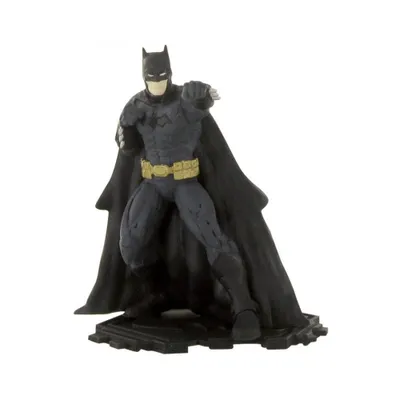 A figurine of Batman standing on a black base.