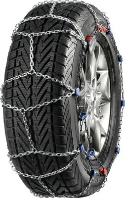 A close-up of a car tire with snow chains attached.