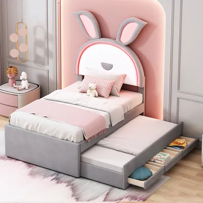 A child's bedroom with a bed featuring a bunny-shaped headboard.