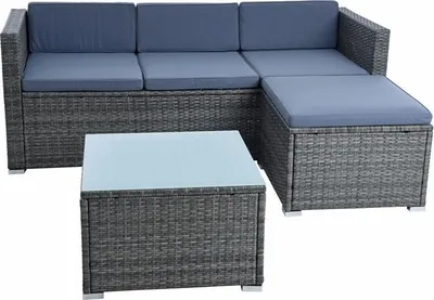 A grey rattan sectional sofa with blue cushions and a matching coffee table with a glass top, displayed on a white background.
