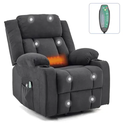 A dark gray massage recliner chair with glowing massage points and a heating element in the lumbar area. A remote control is shown in a small inset box in the upper right corner.