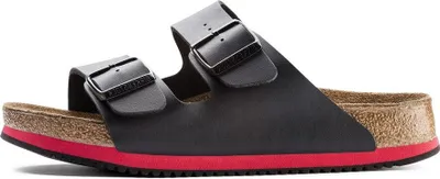 A side view of a black Birkenstock Arizona sandal with a red sole accent.