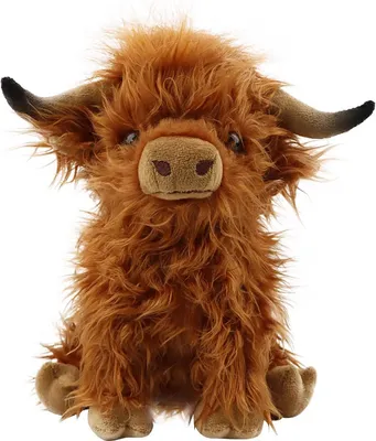 A plush toy of a Highland cow sitting on a white background.