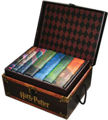 A Harry Potter book set in a trunk.