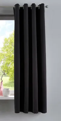 A black curtain hangs in front of a window.
